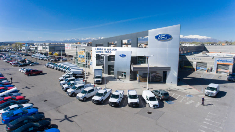 Ford dealership lot with fleet vehicle inventory