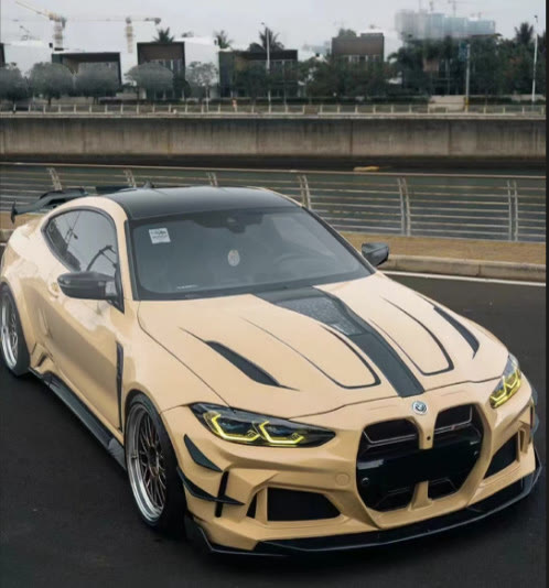 BMW M4 in a custom tan wrap with black accents